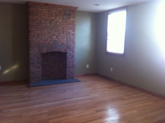 Living room lots of light hardwood floors.