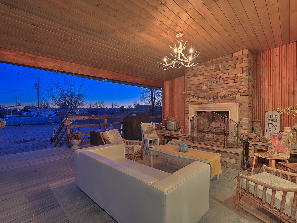 Deck with wood-burning fireplace.