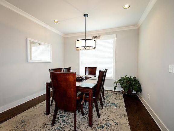 Large dining room table in dining room next to kitchen (2nd floor)