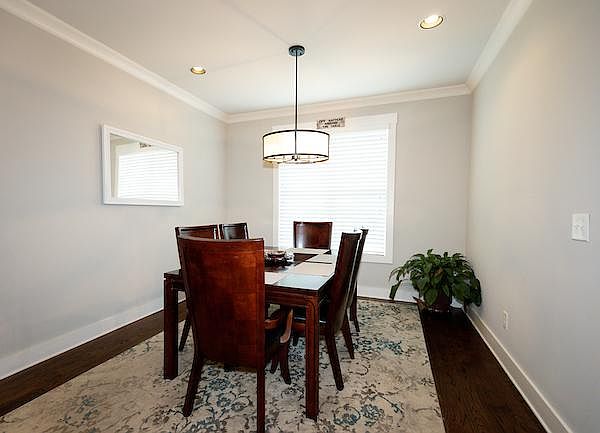 Large dining room table in dining room next to kitchen (2nd floor)