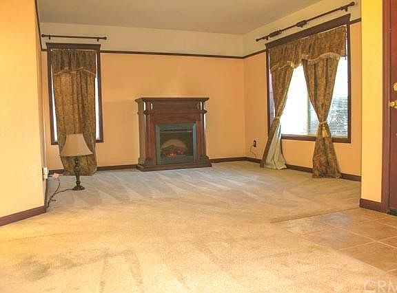 Entry and Living Room with Electric Fireplace.