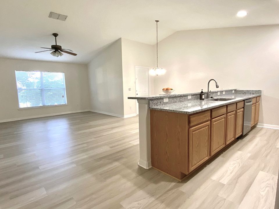 Kitchen with open floor plan, extra spacious with high ceiling