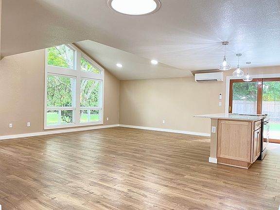 Stunning remodel with open floor plan and architectural features.
