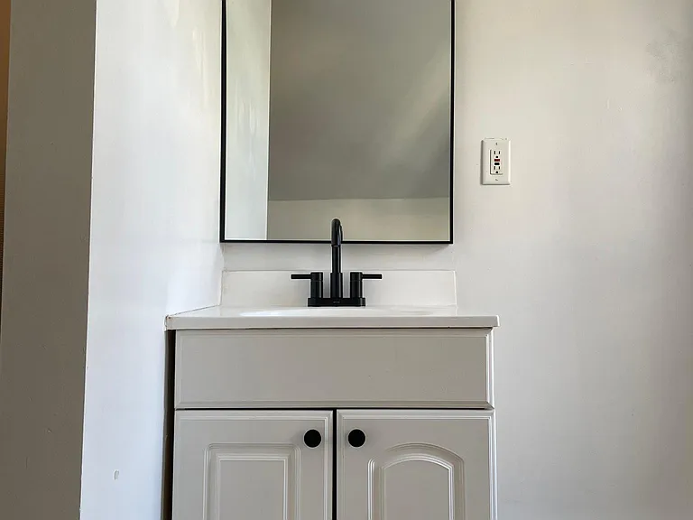 Bathroom- new cabinet pulls, faucet + mirror