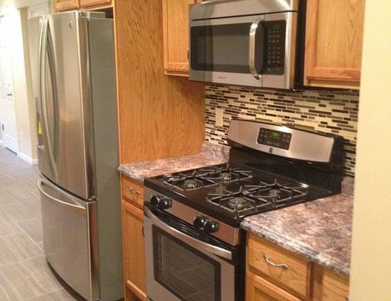 Beautifully remodeled kitchen with new appliances and tile floors