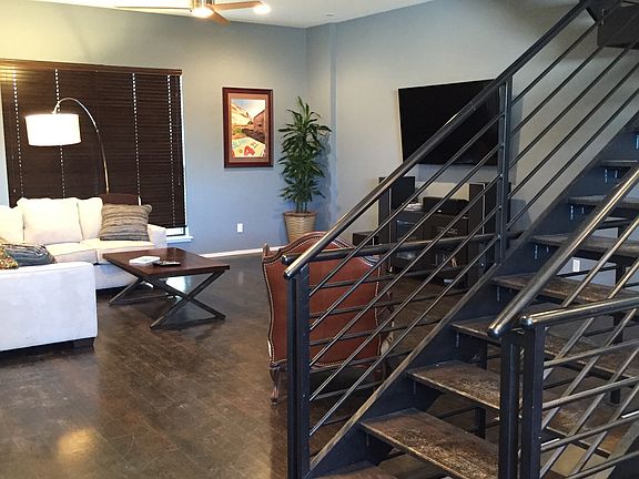 Living area broken up by see-through stairs