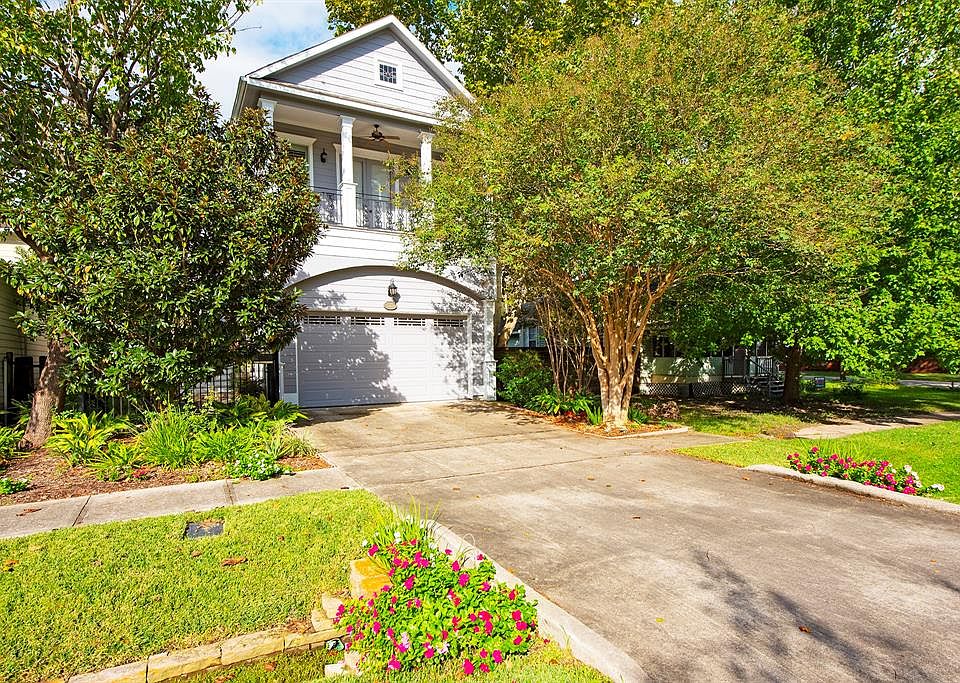 Private driveway and balcony off primary bedroom.