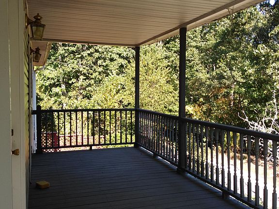 Back deck on second floor. Overlooks a large wild garden in spring, summer, fall.