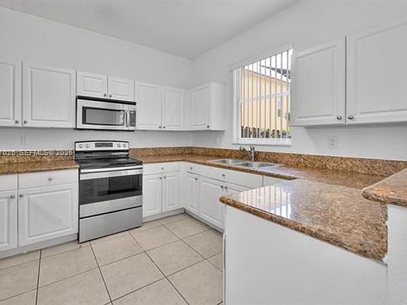 4th image of 12864 SW 133rd Ter #Townhouse 12864