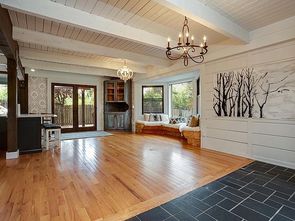 Open floor plan with Living room / dining room, and kitchen to left.