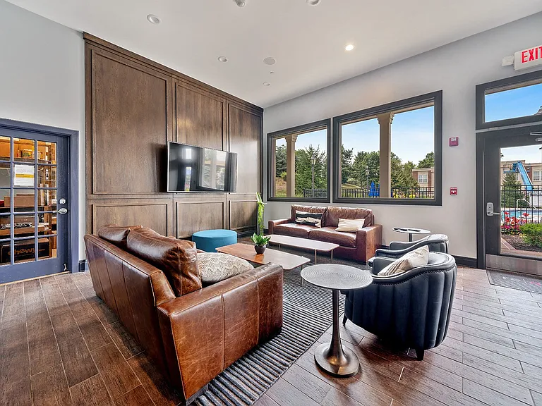 Clubroom with cozy leather seating and TV
