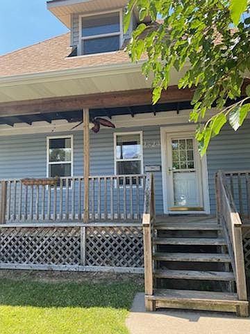 Front Door and Porch with Ceiling Fan.