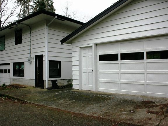 Home has a garage PLUS a detached 2 car garage. Talk about storage and loads of parking!
