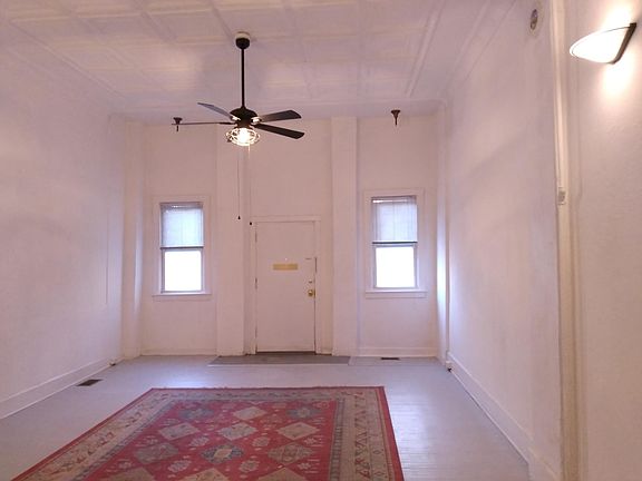with rug looking east - living room/storefront entrance