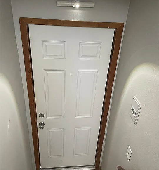 Automatic interior light at exterior entry door