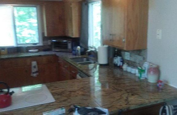 Partial view kitchen, with granite countertops