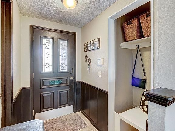 Entry way with mud bench and hooks for your coats, backpacks and bags.