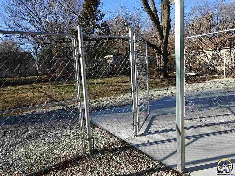 Concrete patio and fenced back yard