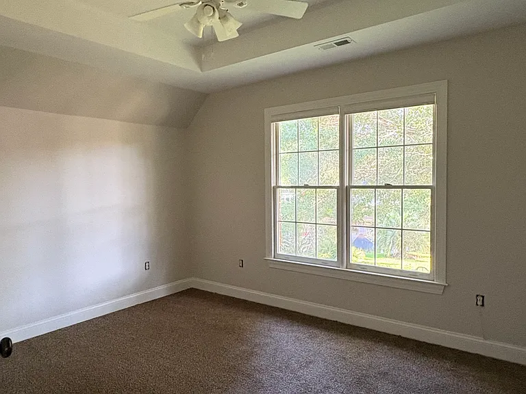 upstairs bedrooms have large closets and double windows. The largest of the three has a large walk-in closet and private bath.
