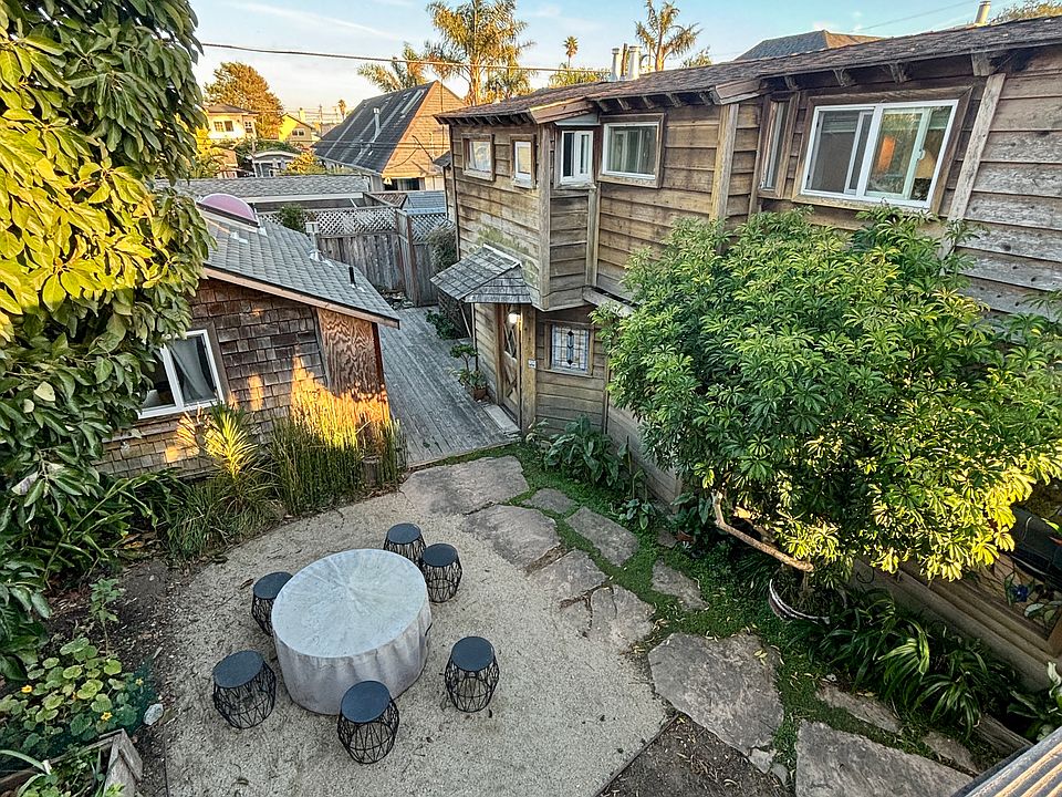 View of garden and outdoor firetable from sundeck