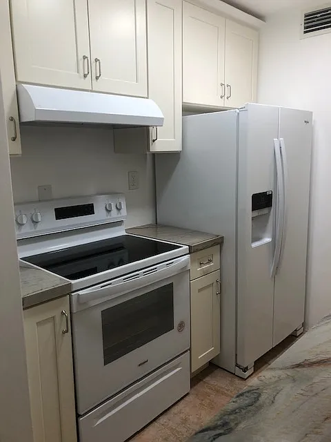 Side by Side Whirlpool refrigerator with icemaker