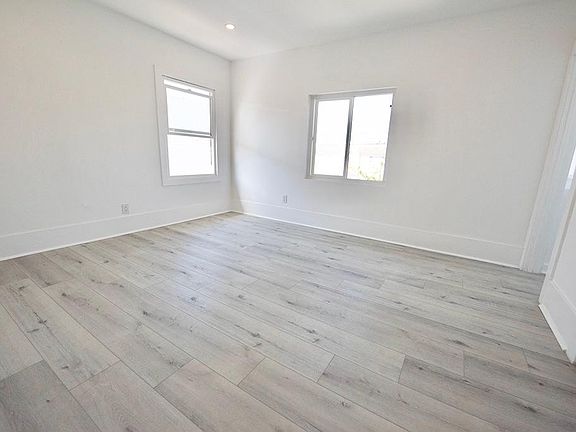 Bedroom 1, new floors, lots of light!