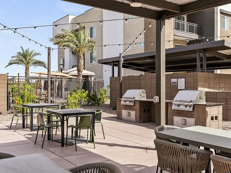Gas grills with table seating