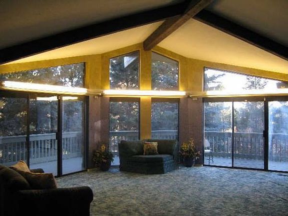 Grand Living Room walks Out to Wrap-around Deck