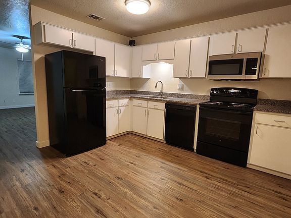 Large kitchen with granite countertops, lots of cabinets with modern doors and pulls, air switch for new disposal and all new appliances.
