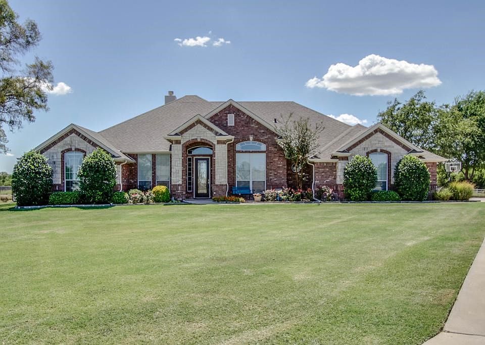 Stunning Custom-Built Brick & Stone Executive Home in the community of Van Zandt Farms and located in Northwest ISD.