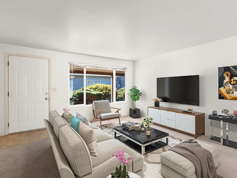 Living room with large front window ( Staged)