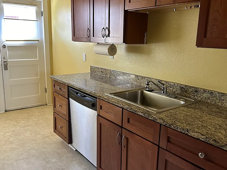 Full sized kitchen with granite counters