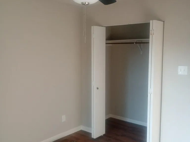 3rd bedroom closet, completely remodeled with laminate flooring.