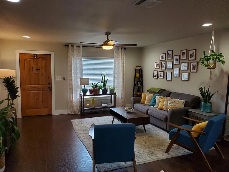 Living room shown with furniture (previous tenant)