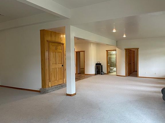 Sitting area to the left and Right, looking to the East to the bedrooms and bathroom