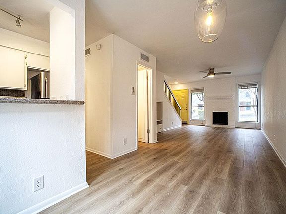 Includes a fireplace in the living room.