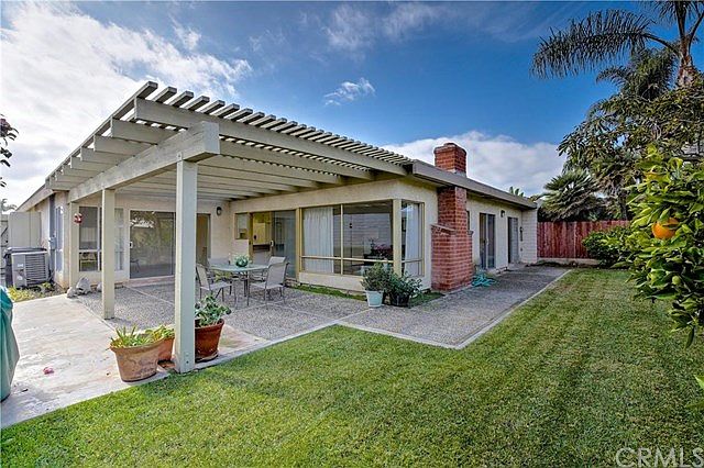 Wonderful back yard with walls of glass looking out.