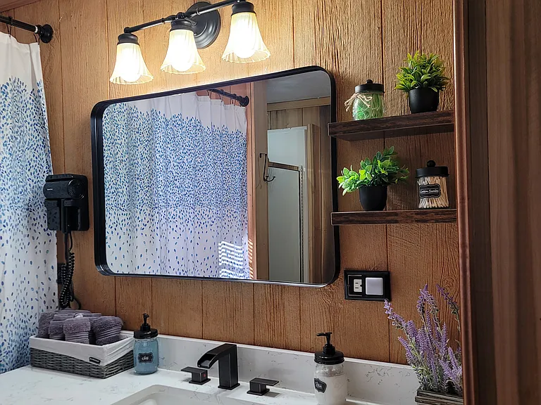 Bathroom vanity, Stacked washer and dryer behind shower curtain