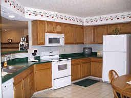 Pleasant eat-in kitchen with desk area.