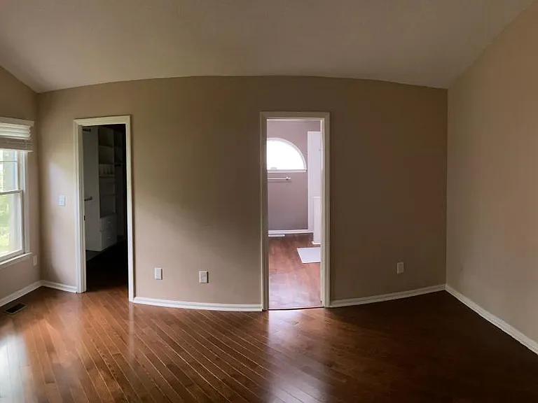 Master bedroom, walk-in closet on left, master bath on right.