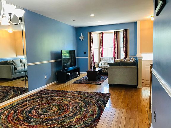 Large living room with hardwood flooring