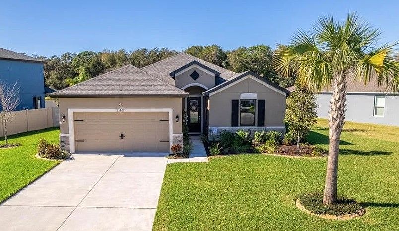 Sweetwater new construction home plan tuscan elevation with optional stone William Ryan Homes Tampa