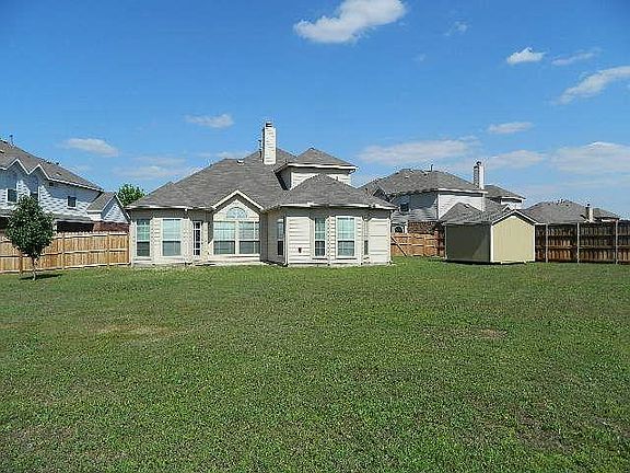 Huge backyard (over one-third acre) with storage shed and lots of room for the kids to play