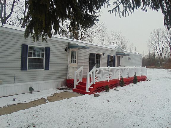Freshly painted large deck greets you as you enter this home.
