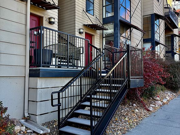 Front door is well off the street up the stairs above these two units.