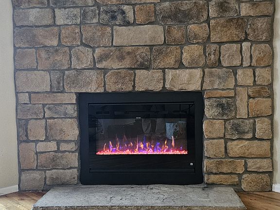Stone fireplace with new insert