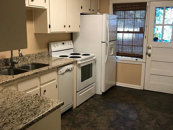 Kitchen: Dishwasher, refrigerator, oven/stove, pantry off of kitchen, back door to yard.