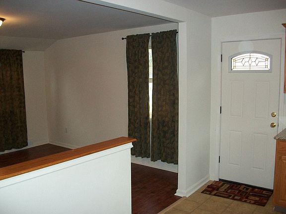 LIVING ROOM OPENS TO KITCHEN