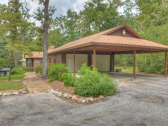 There is plenty of covered parking with the oversized 2-car garage and huge car port.