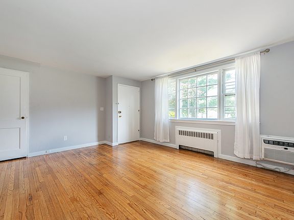 Spacious living room with hard wood floor